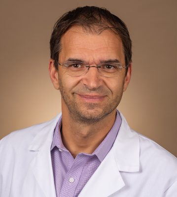 Headshot photo of Razvan Baltescu, MD