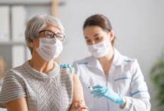 Doctor,Giving,A,Senior,Woman,A,Vaccination.,Virus,Protection.,Covid-2019. Doctor giving a senior woman a vaccination. Virus protection. COVID-2019.