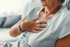 Female,With,Chest,Pain.,Senior,Woman,Suffering,From,Heartburn,Or Female with chest pain. Senior woman suffering from heartburn or chest discomfort symptoms. Acid reflux or Gastroesophageal reflux disease (GERD) concept