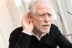 Portrait Of Senior Man Having Hearing Problems